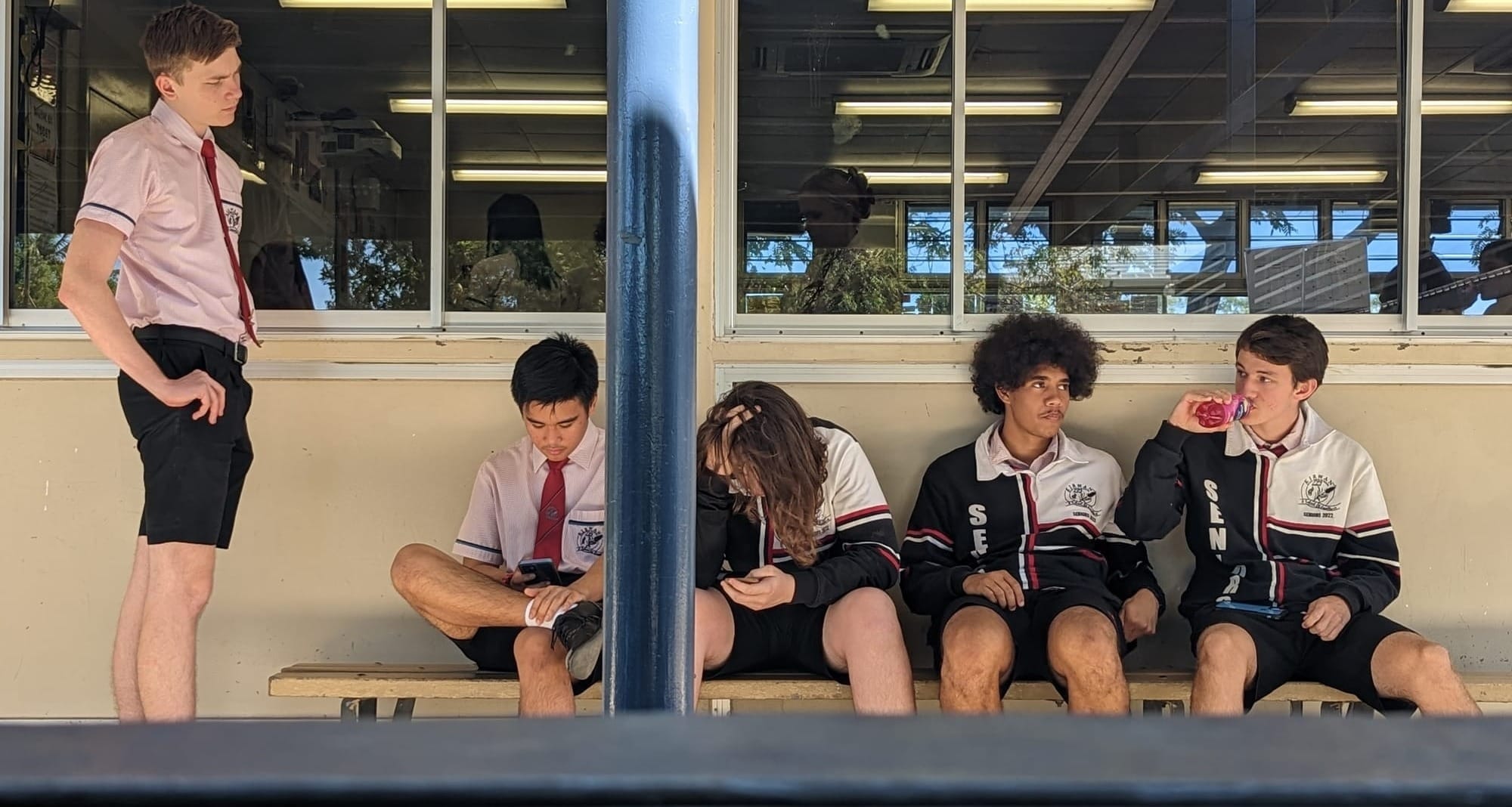 Five Australian high school students hanging out during lunch break